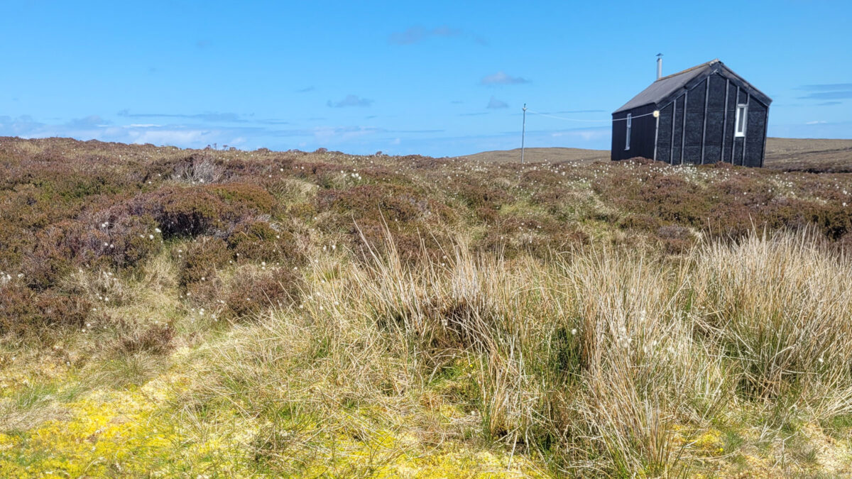 Hut on the horizon at Cuidhsiadar on the Isle of Lewis