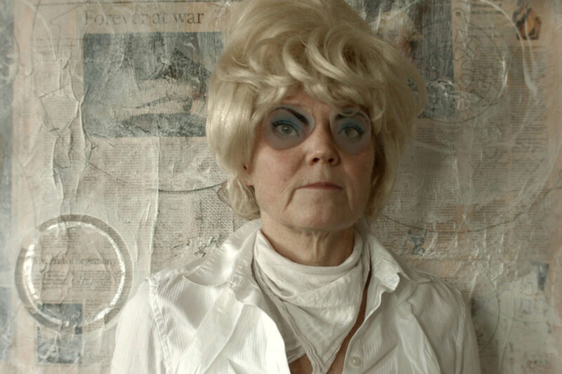Close-up of channel one from Old dear in the headlamps showing figure in a blonde wig