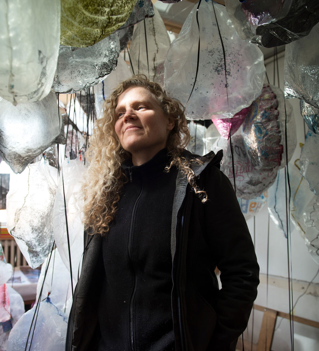 Artist Michele Marcoux in her studio with balloons from the installation GYRE